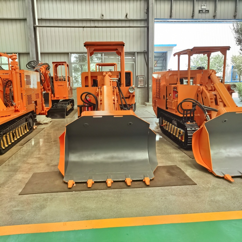 Chargeuse de roches à déversement latéral