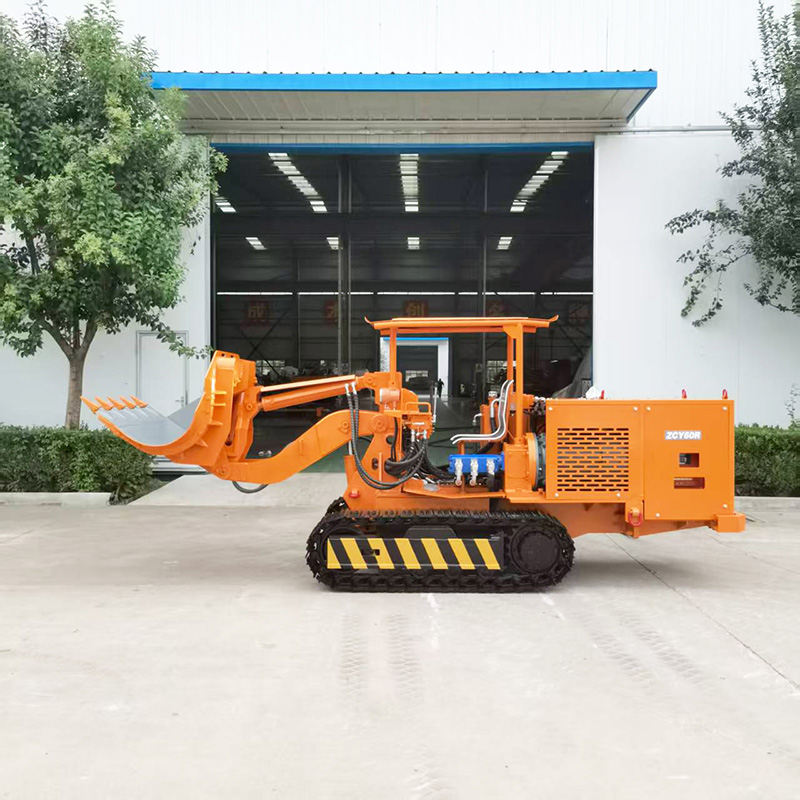 Máy xúc đá dỡ hàng bên khai thác